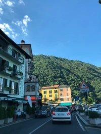 Quaint Town Street Surrounded by Lush Mountains