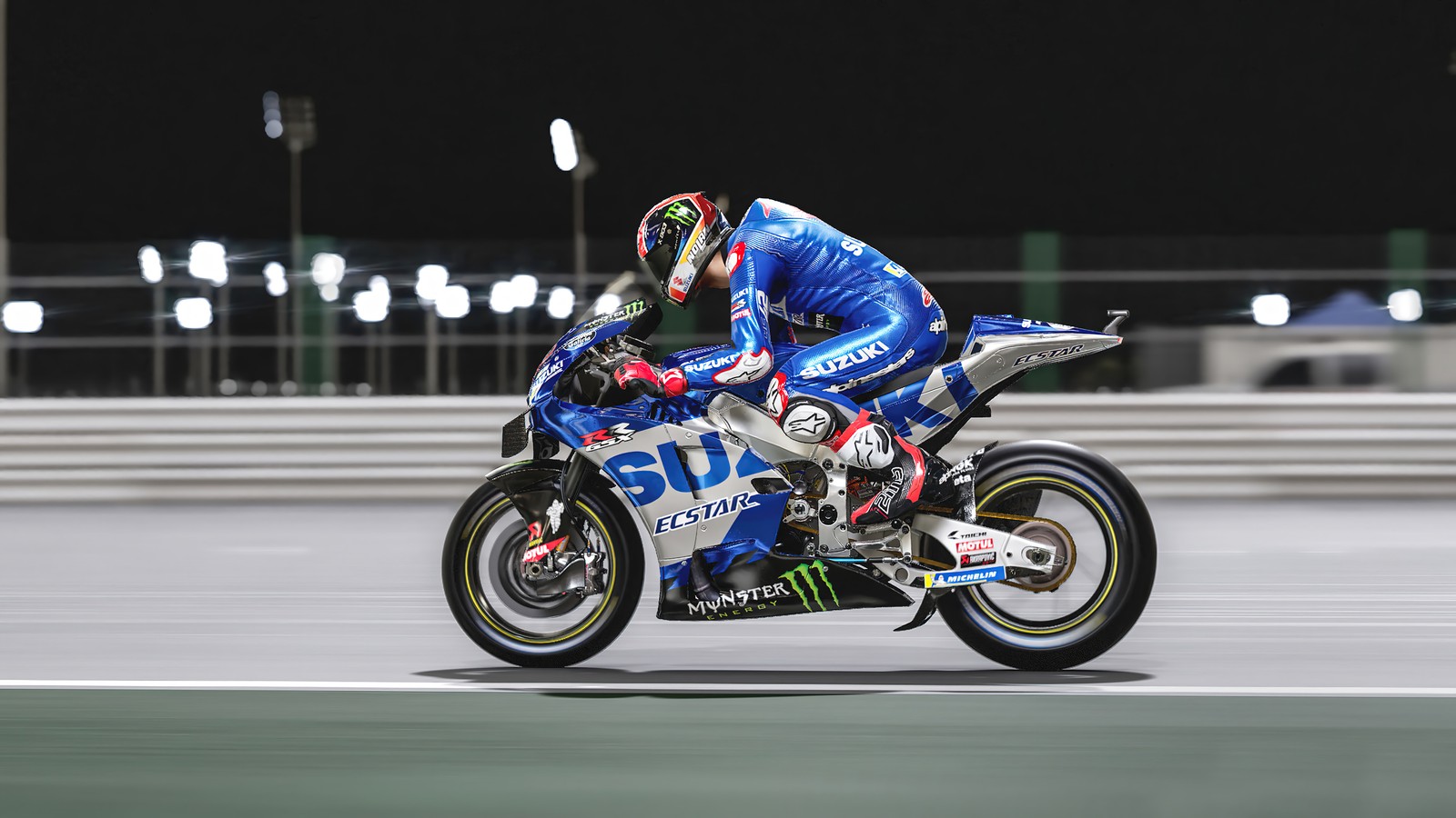 Un motociclista vestido de azul y blanco montando en una pista (motogp 22, videojuego, motocicleta, carreras)