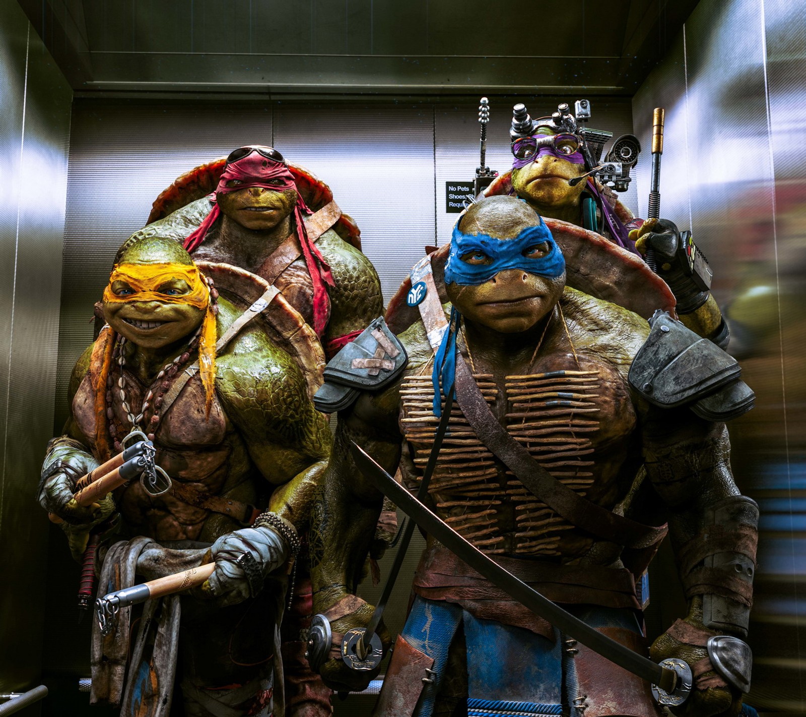 There are two teenage mutant turtles standing in an elevator (ninja, turtles)