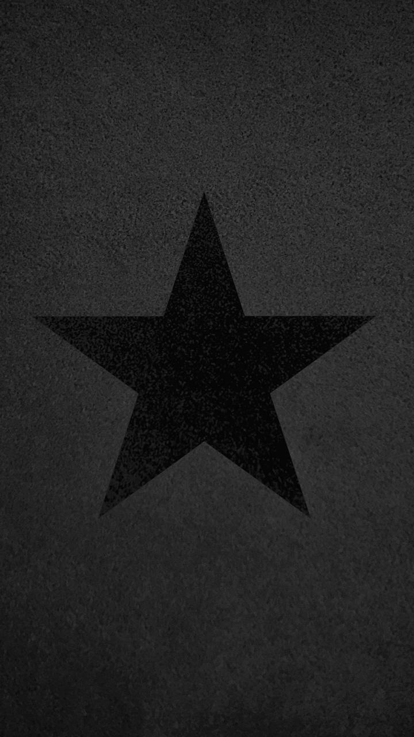 Una estrella negra sobre un fondo negro con un fondo blanco (negro, pesado, heavy metal, tinta, logotipo)