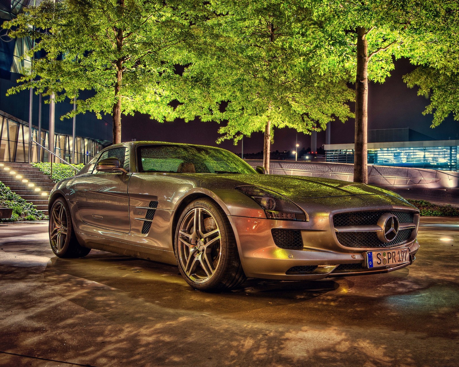 A close up of a mercedes sports car parked in a parking lot (benz, bronze, car, hd, night)