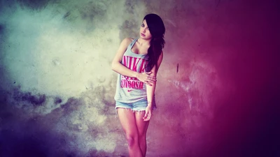 Fashionable Woman in Nike Tank Top and Shorts Against a Colorful Background