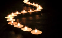 Illuminated Path of Tealight Candles