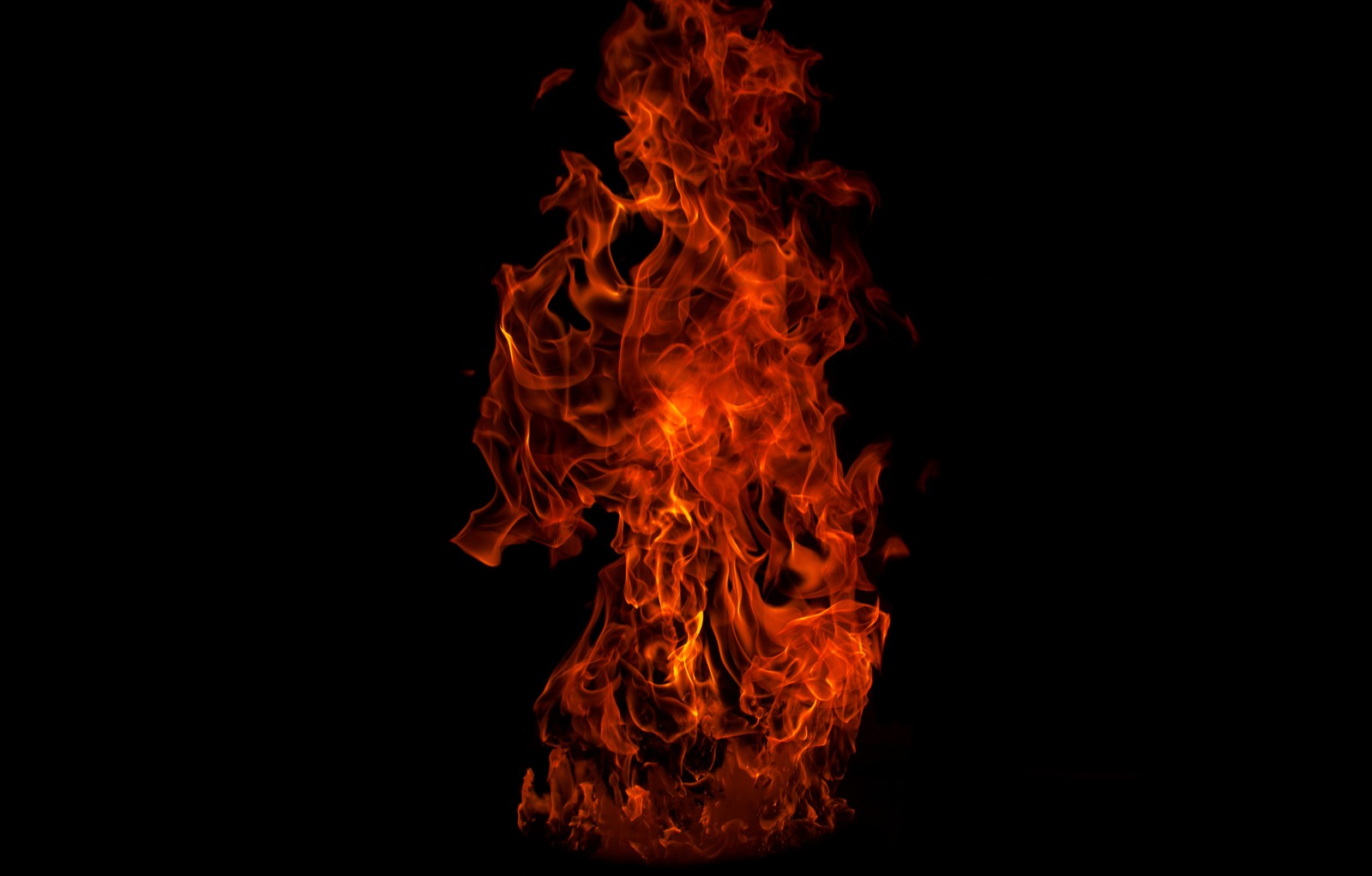 A close up of a fire on a black background with a black background (flame, fire, heat, bonfire, campfire)