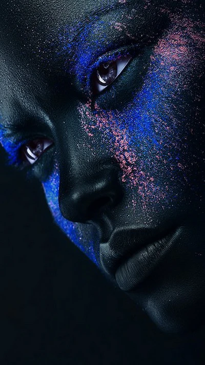 Glittering Beauty: A Close-Up of a Girl's Face with Striking Body Art