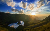 Atardecer sobre el lago Schrecksee: Una reflexión serena entre majestuosas montañas