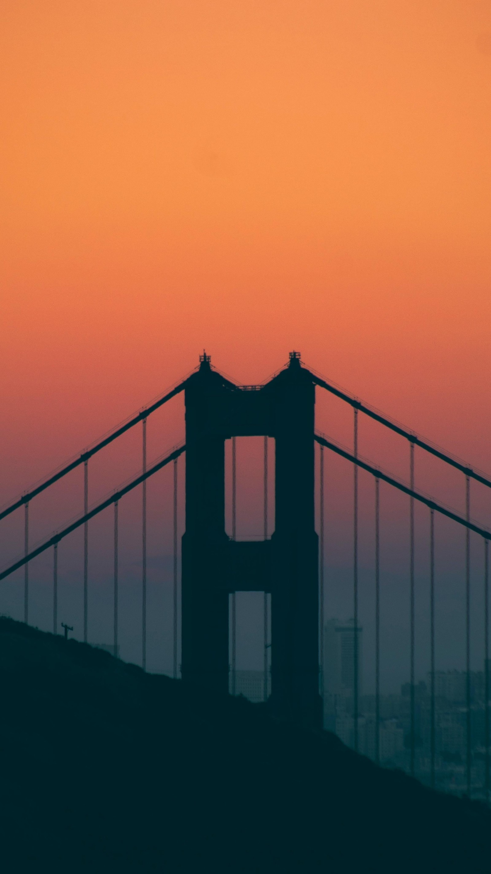 Arafed view of a bridge with a plane flying over it (golden gate bridge, atmosphere, cloud, body of water, afterglow)