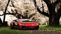 Lamborghini Aventador SV parmi les cerisiers en fleurs au printemps