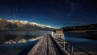 Sternen Nacht über dem See mit malerischer Bergreflexion in Neuseeland