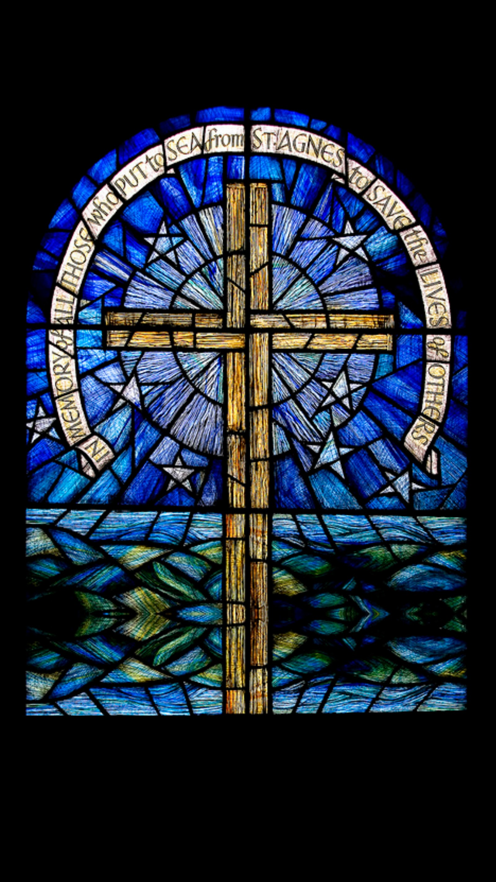 A close up of a stained glass window with a cross (cross, faith, glass, religion, stained)