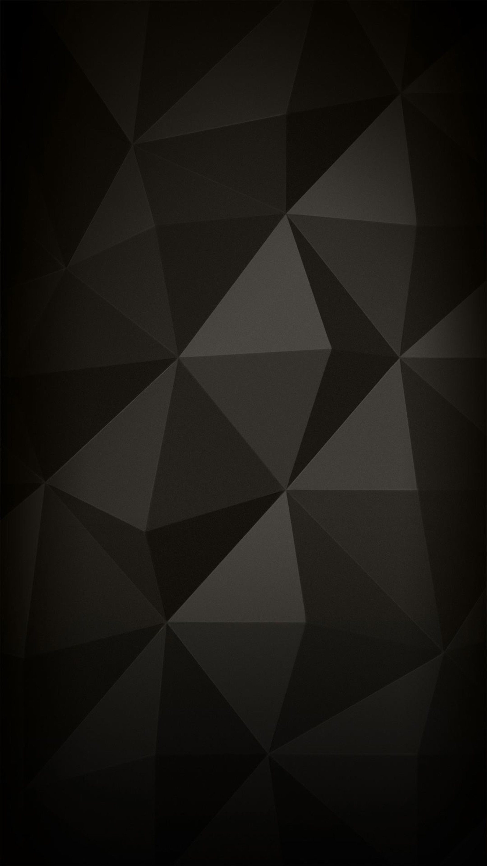 A close up of a black background with a triangle pattern (light, design, brown, grey, triangle)