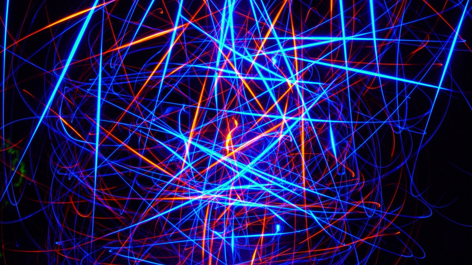 A close up of a blue and red light in a dark room (neon lighting, light, neon, line, pattern)