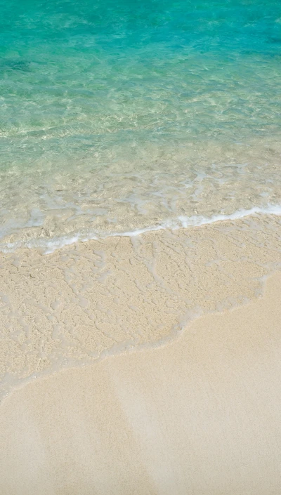 Serene Beach Waves Under a Sunlit Ocean