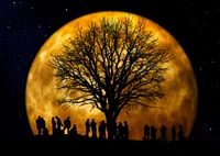 Silhouetted Figures Beneath a Golden Supermoon