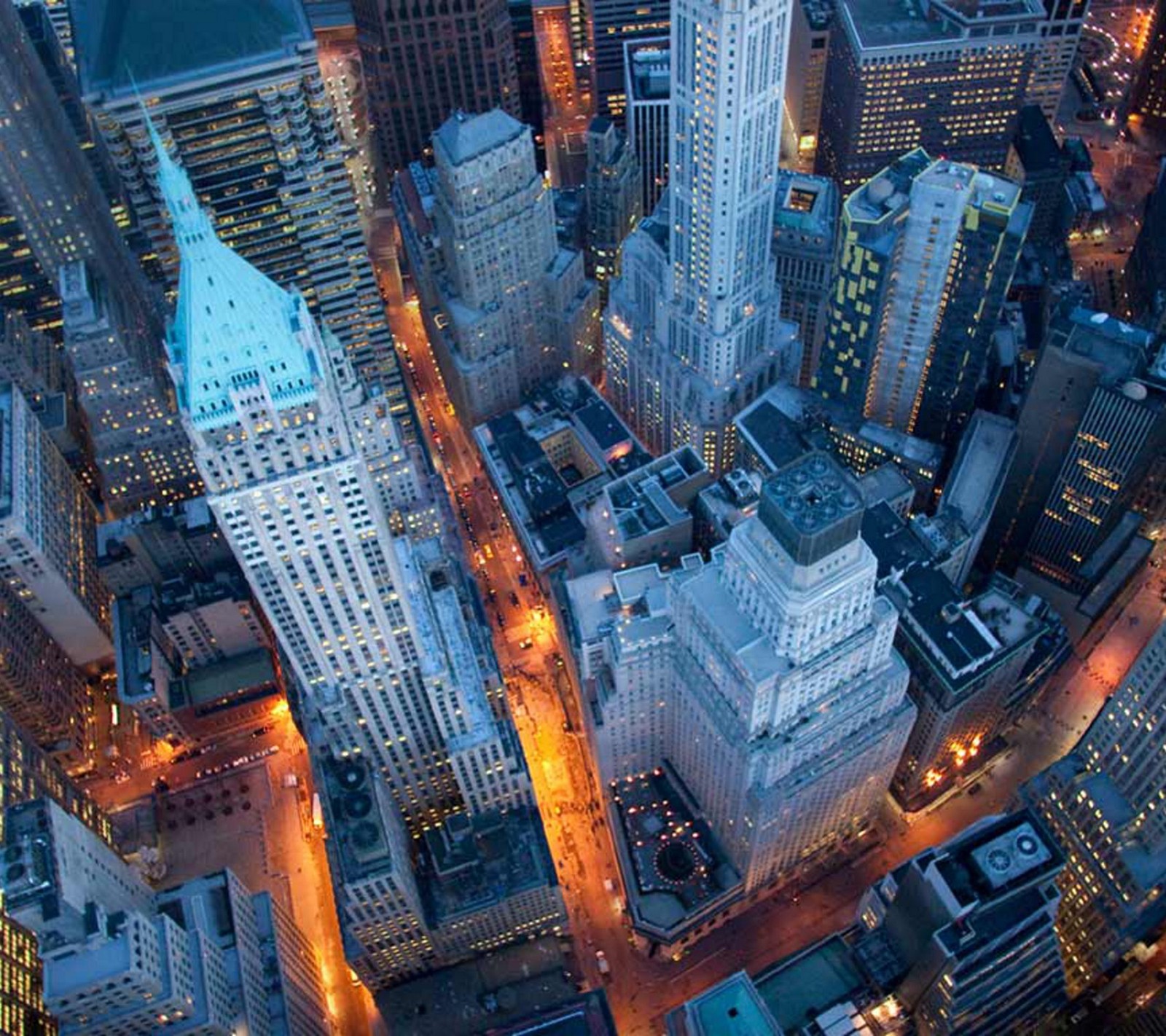 Arafed view of a city at night with a lot of tall buildings (above, buildings, city, downtown, new york)