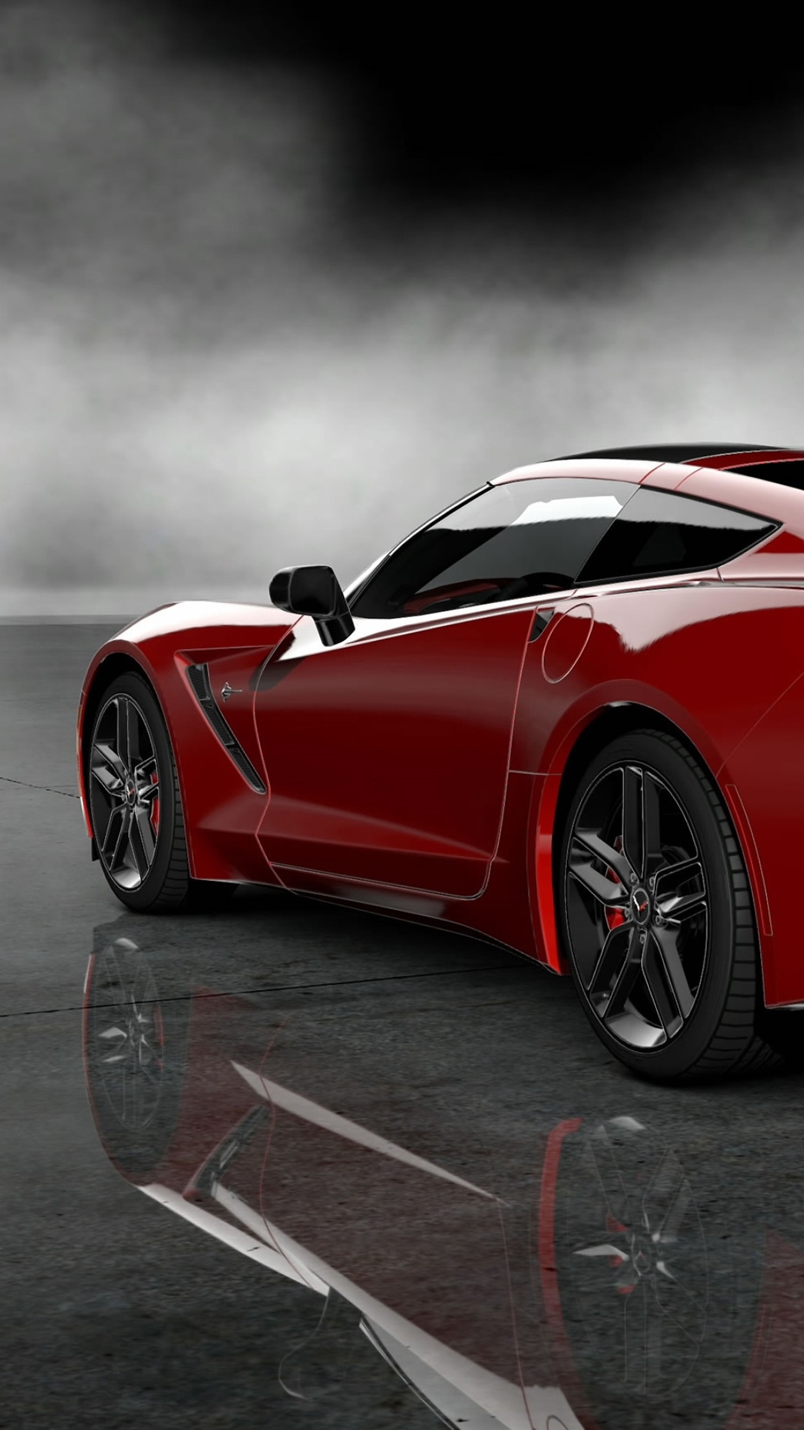 A close up of a red sports car on a reflective surface (auto, car, corvette)