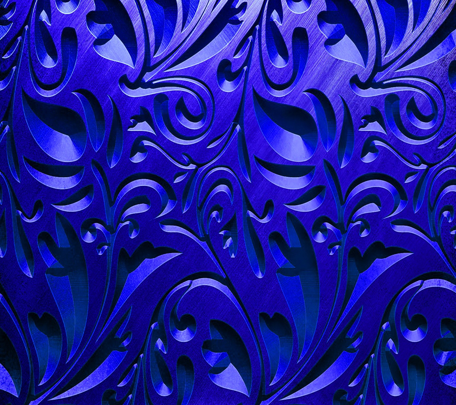 A close up of a blue wall with a pattern of swirly shapes (blue metallic, texture pattern)