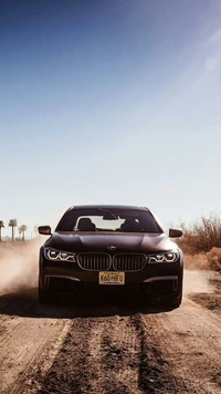 BMW M760Li XDrive: Front View of Luxury V12 Performance on Dusty Terrain