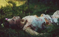 Girl in Floral Dress Amidst Sunlit Nature