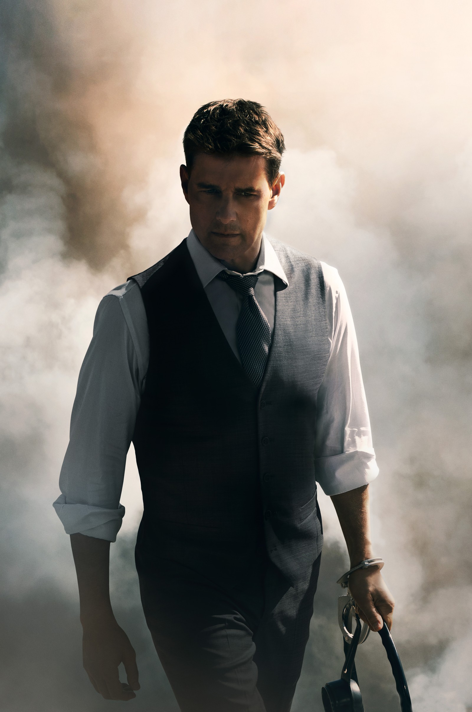 There is a man in a vest and tie walking through smoke (tom cruise as ethan hunt, mission impossible dead reckoning, 2023 movies, movies, 4k wallpaper)