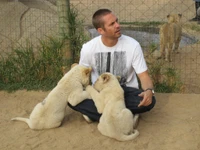 Paul Walker Interacting with Young Lions at a Wildlife Park