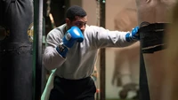 Jonathan Majors training intensely in a boxing gym for "Creed III.