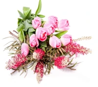 Elegant pink tulips arranged with vibrant greenery and complementary flowers.