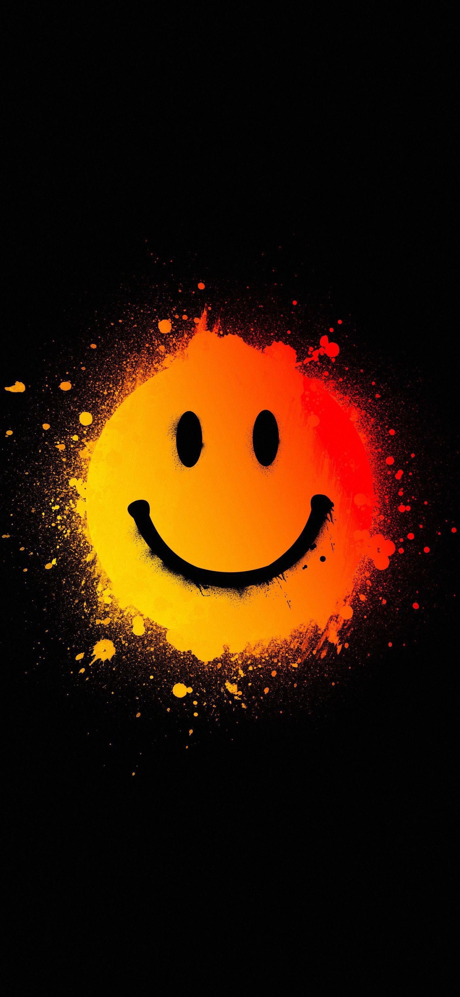 Smiley-gesicht auf schwarzem hintergrund mit farbspritzern (smiley, emoji, nase, kopf, kinn)