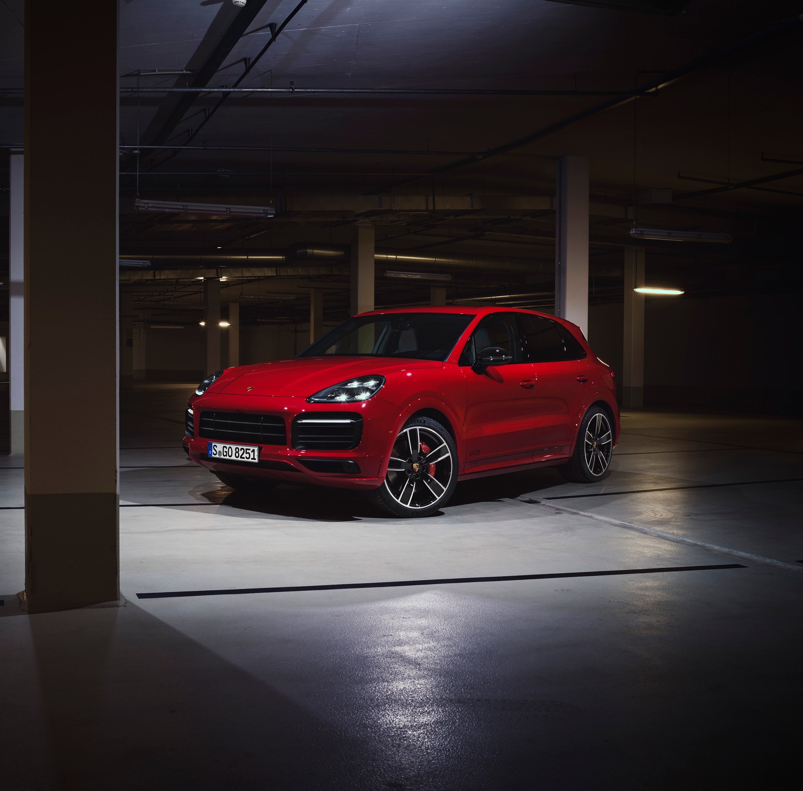 A red porsche cayen is parked in a parking garage (porsche cayenne gts, 2020, cars, 4k wallpaper)