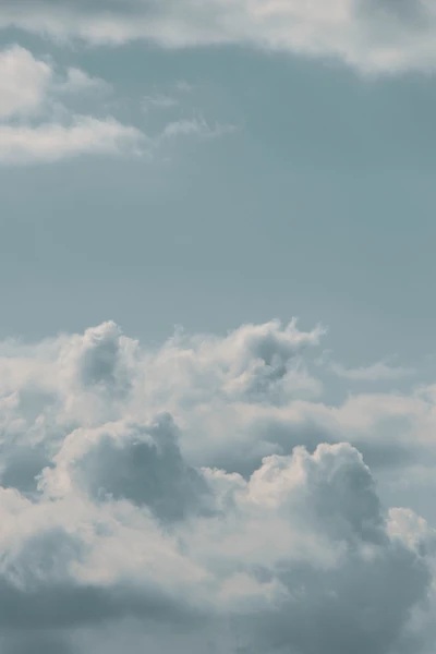 Tranquil Blue Sky with Fluffy Cumulus Clouds