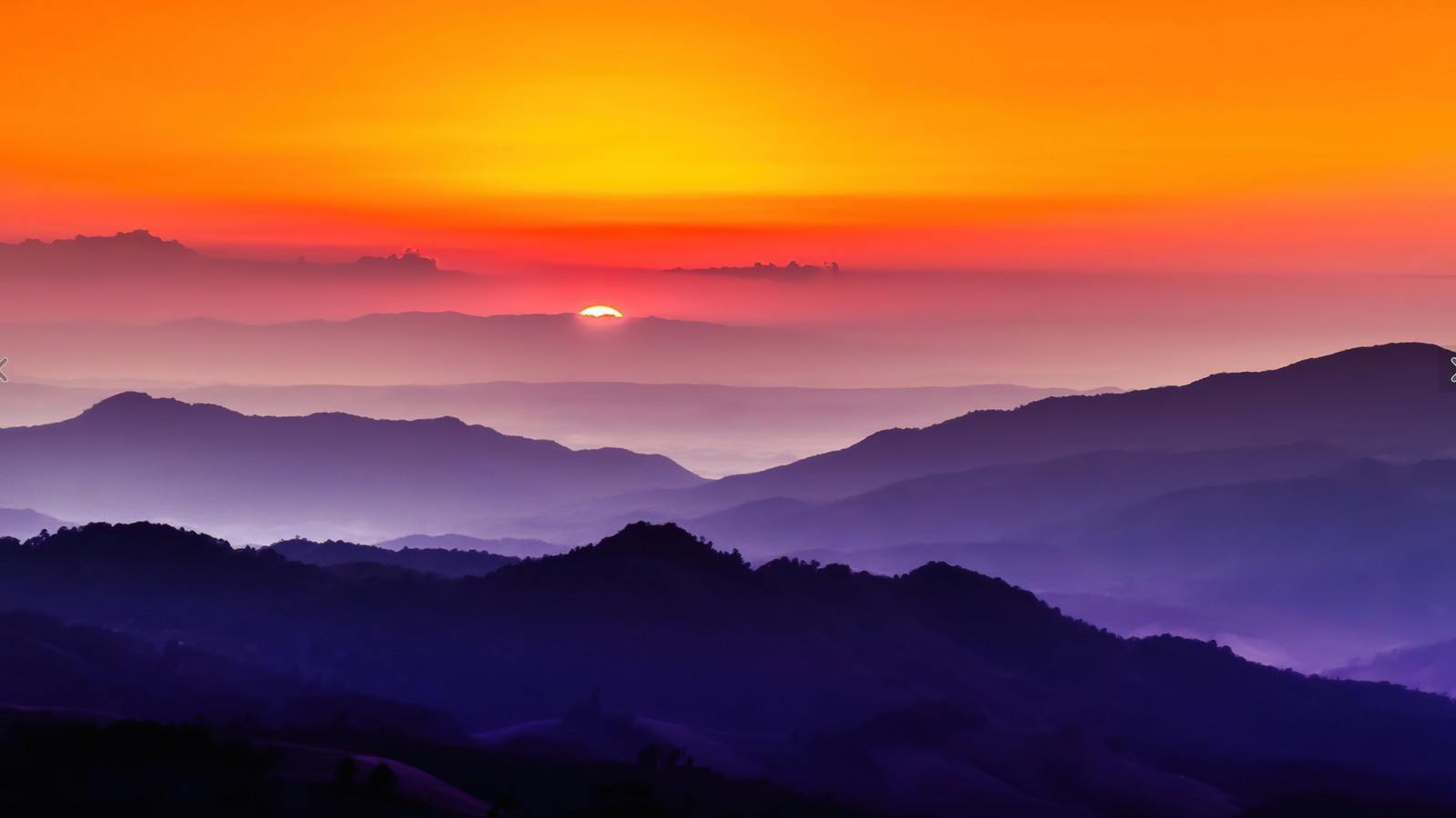 A sunset view of the mountains and the sun setting (sunset, landscape, mountain, scenery)