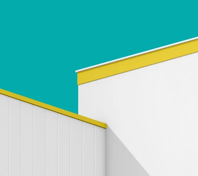 Lignes architecturales colorées : angles jaunes et turquoise contre un mur gris