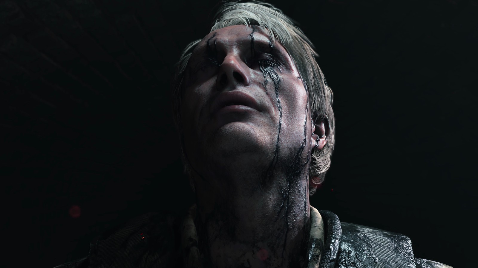 Eine nahaufnahme einer person mit blutigem gesicht und einem messer (death stranding, videospiel, mads mikkelsen)