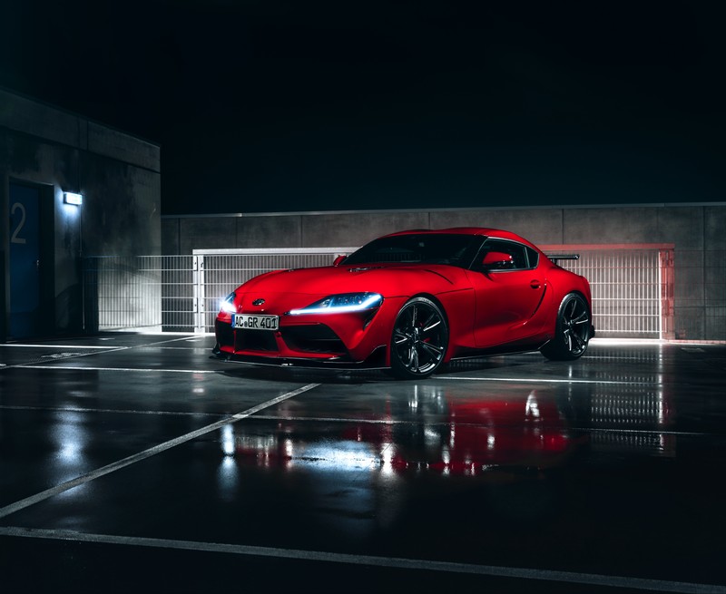 Красный toyota gr supra припаркован на парковке ночью (тойота гр супра, ac шницер, ac schnitzer, 5k, машины)