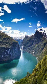 Majestic American River Carving Through Lush Mountains and Sky.