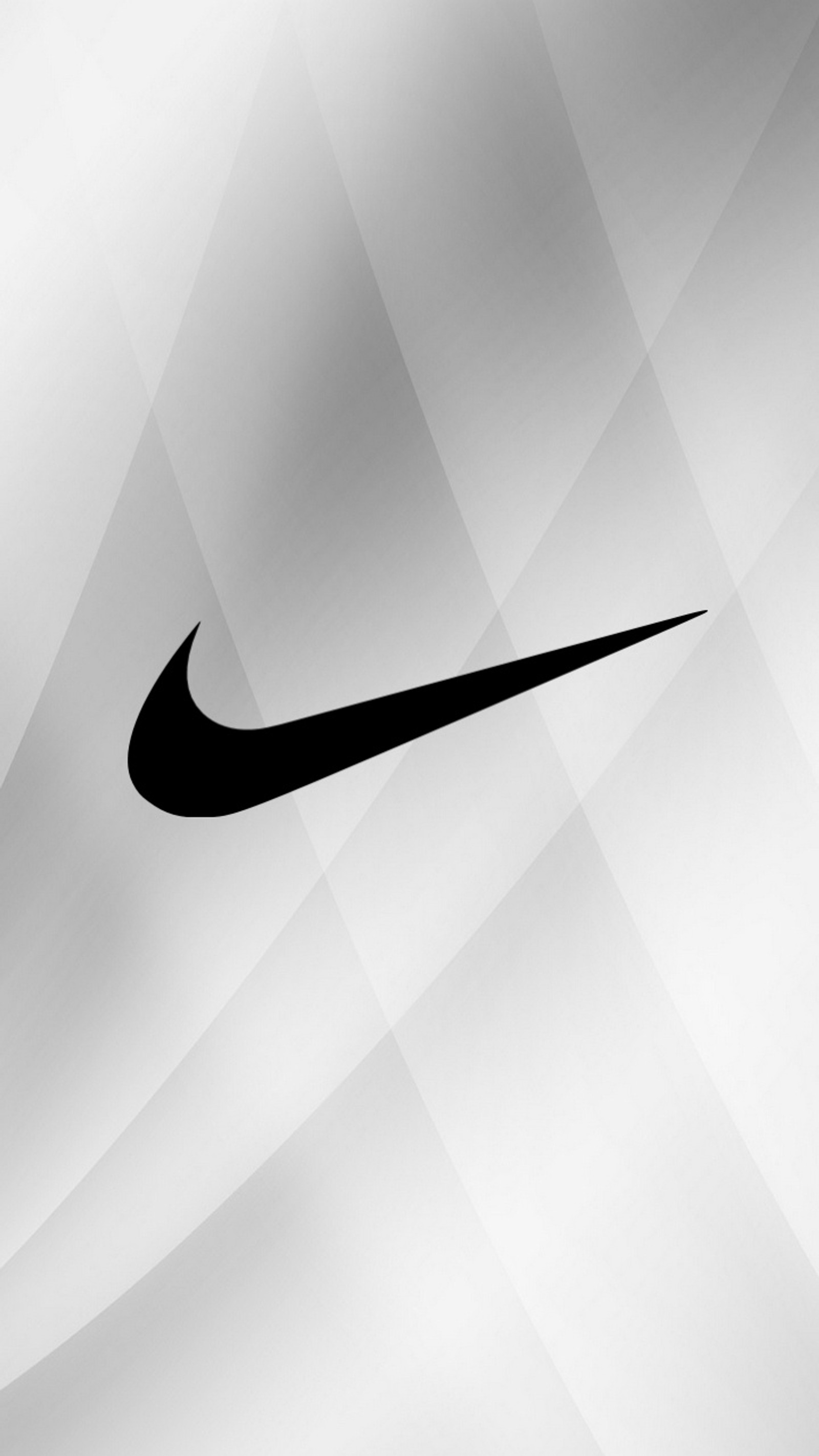 Un primer plano de un logo de nike en blanco y negro sobre un fondo gris. (gris, logotipo, nike)