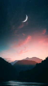 Serene Twilight Over Mountains Under a Crescent Moon