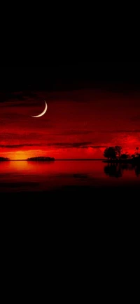 Crescent Moon Glowing Over a Serene Red Afterglow Lake Landscape