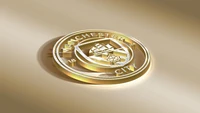 Escudo del Manchester City FC sobre un fondo dorado