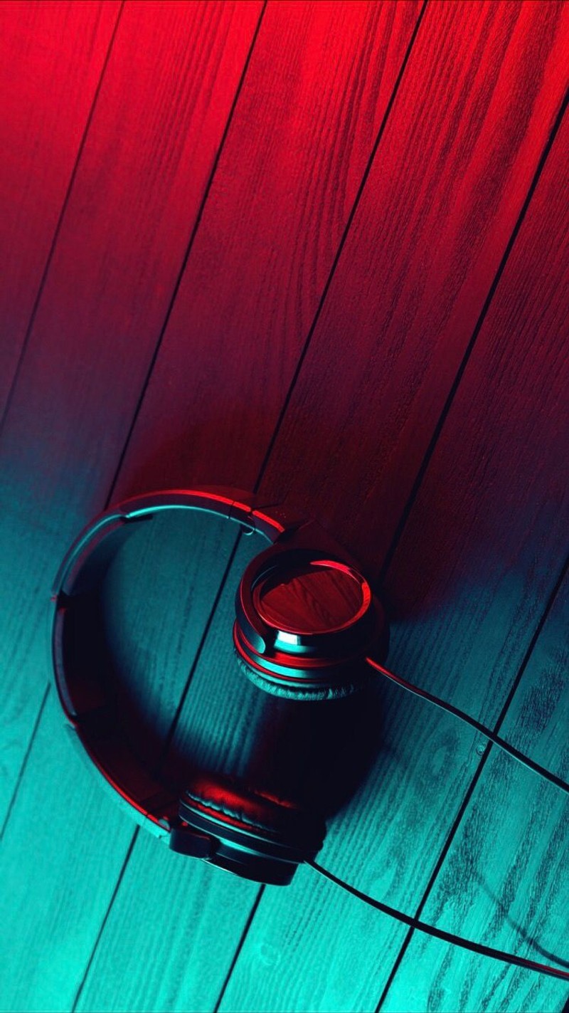 There is a red and blue photo of a headphone on a wooden floor (black, galaxy, note, logo, gold)