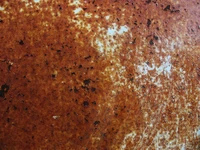 Texture métallique rouillée avec patine brune et motifs usés