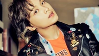 Haechan from NCT 127 in a stylish leather jacket, exuding charisma and confidence.