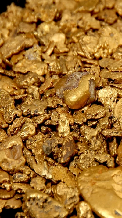 Shimmering Gold Nuggets: A Display of Wealth in Metal