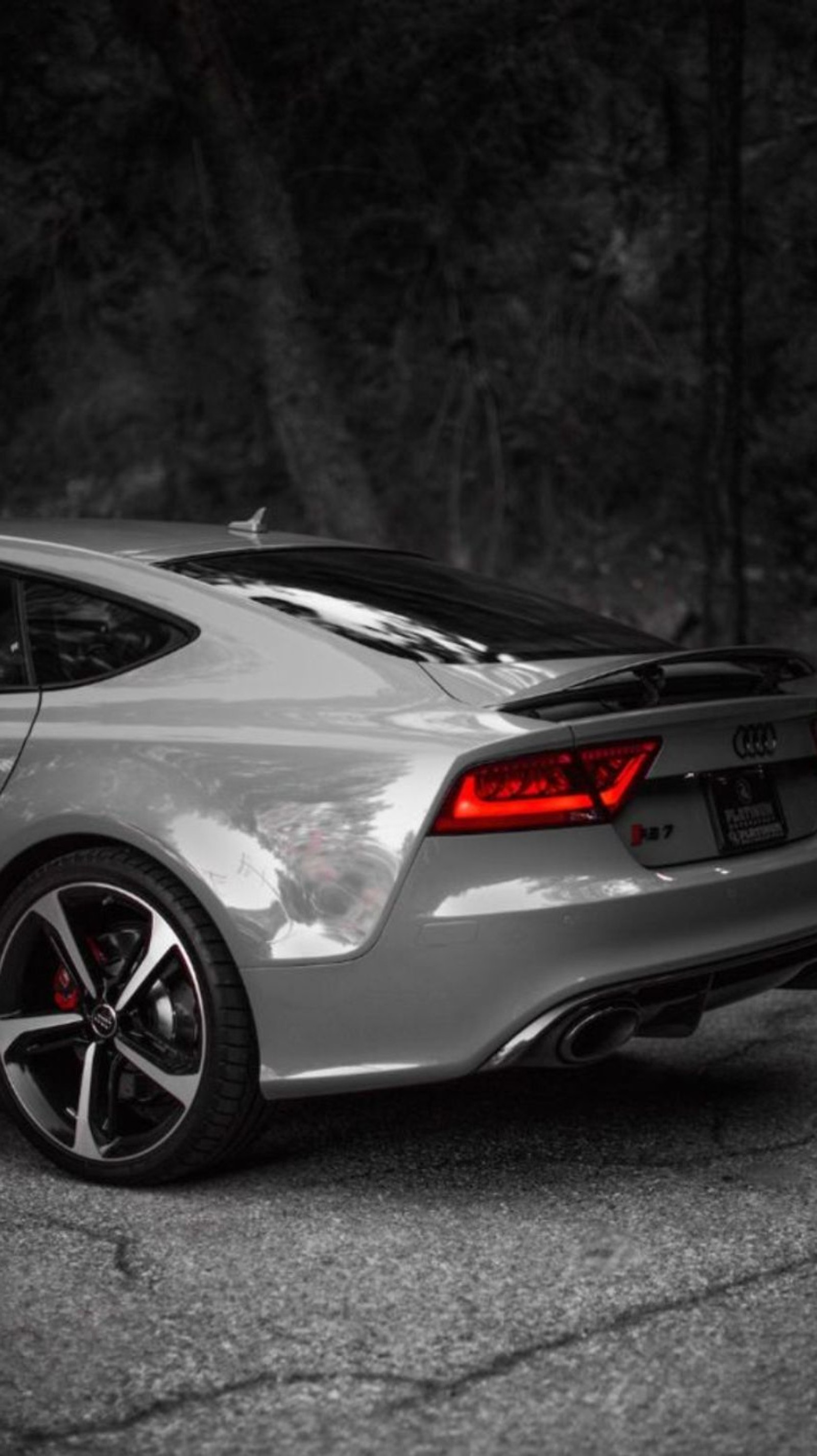 A close up of a car parked on a road near a forest (audi, car, rs7, sport)