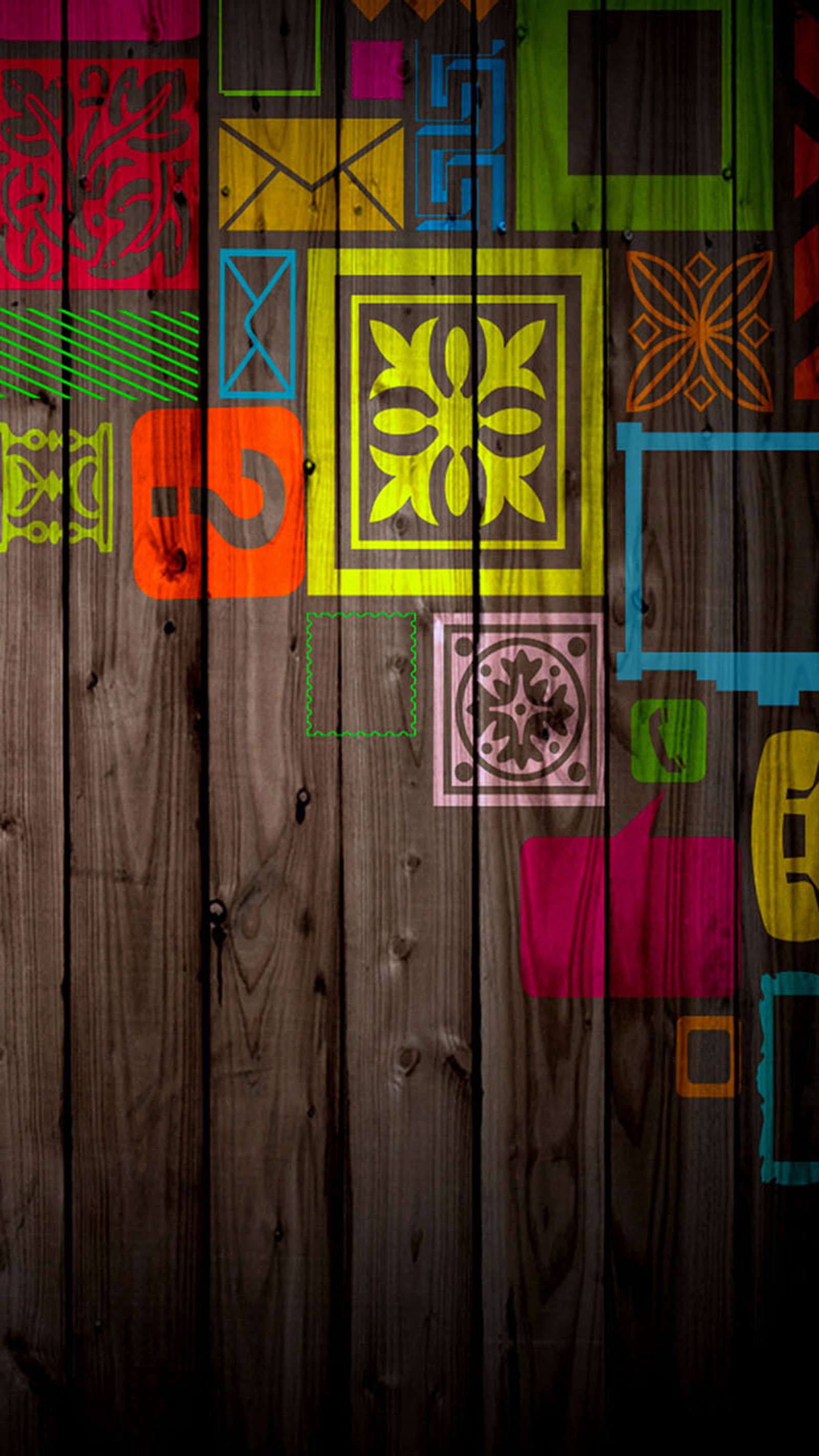 Brightly colored squares and squares on a wooden wall with a dark background (pattern, wall)