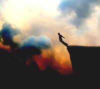 Contemplation at the Edge: A Solitary Figure Against a Dramatic Sky