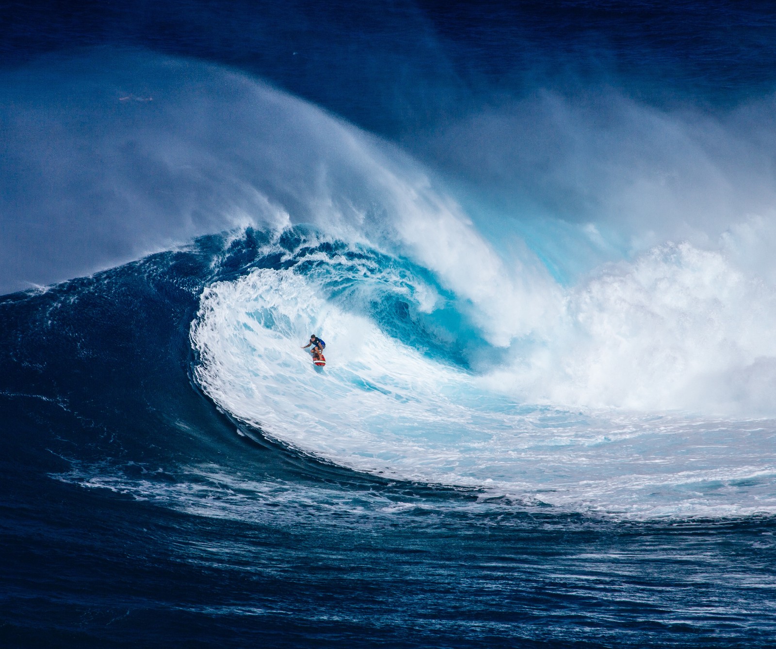 Surfer riding a large wave in the ocean on a surfboard (blue, blueberry, fun, july, summer)