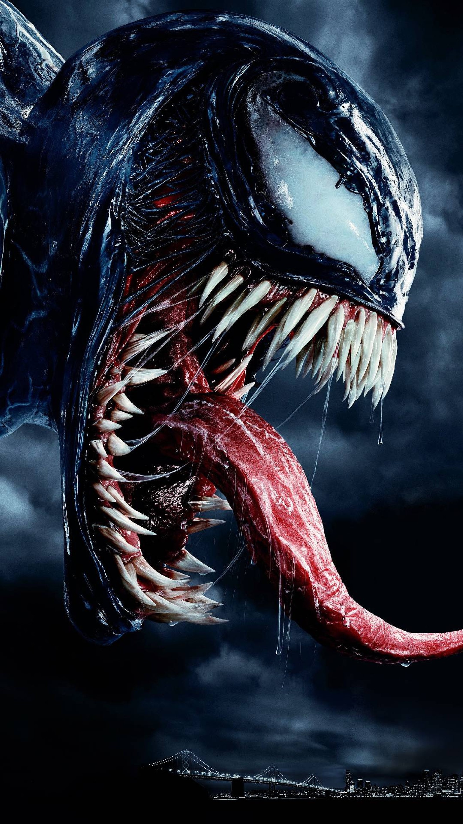 Venom is a very scary looking creature with sharp teeth (venom, marvel, movie)