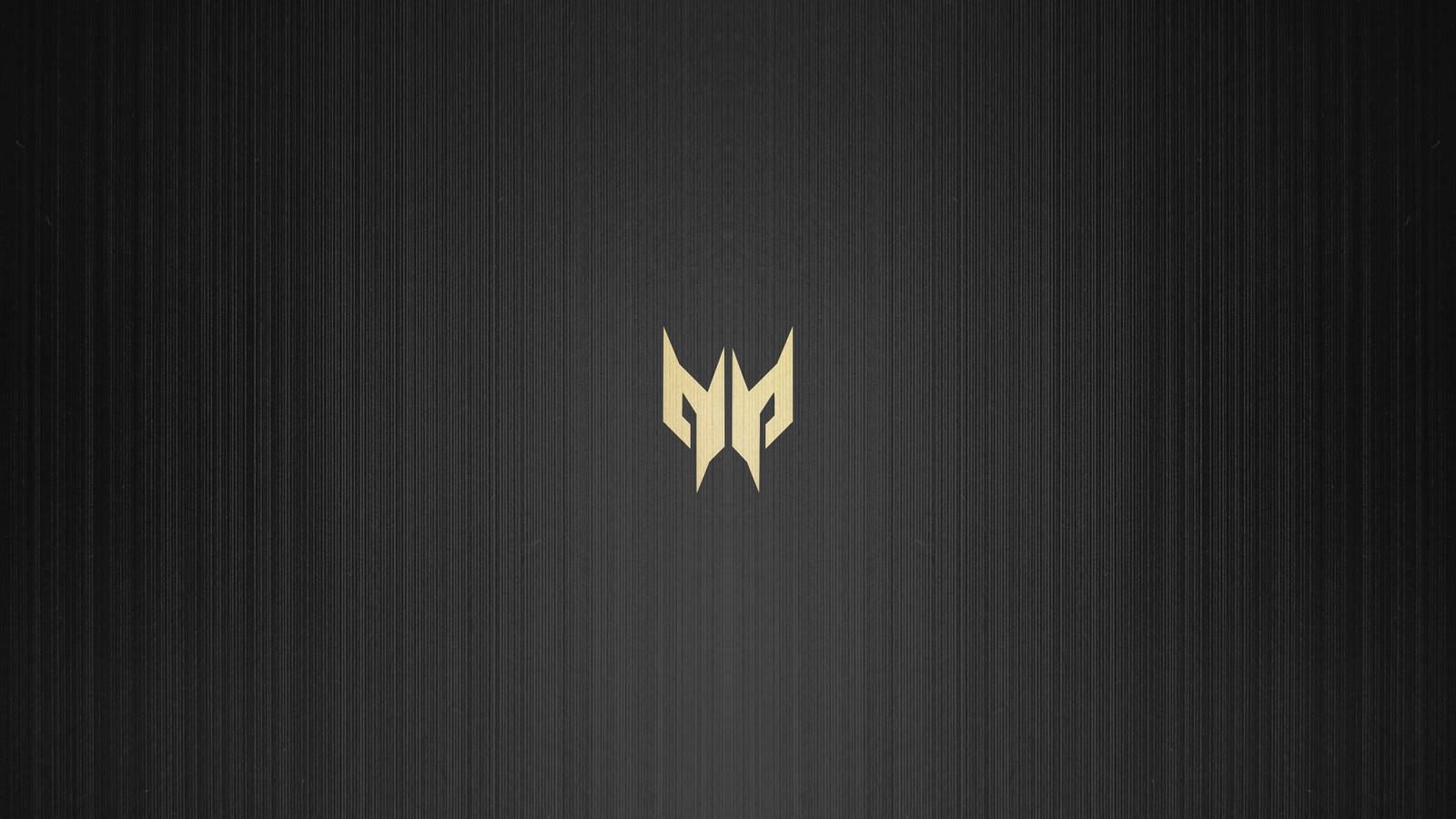 Un logotipo negro y dorado sobre una superficie de madera (acer predator, logotipo)