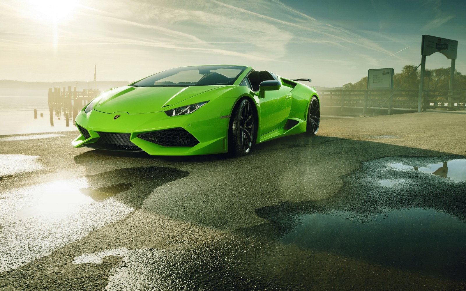 A green lamb sports car parked on a wet road (lamborghini, car, novitec group, supercar, green)